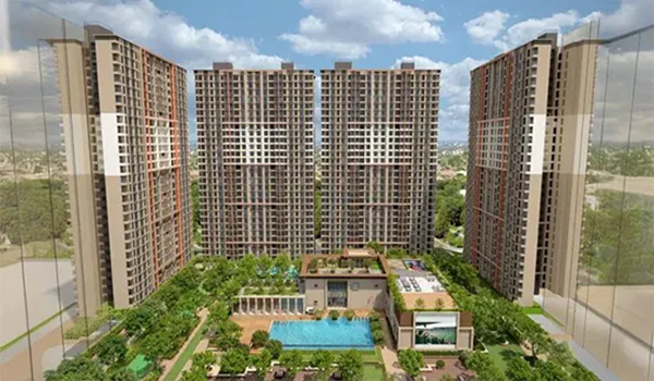 Landscaped gardens and lifestyle amenities at Birla Evam residential project.